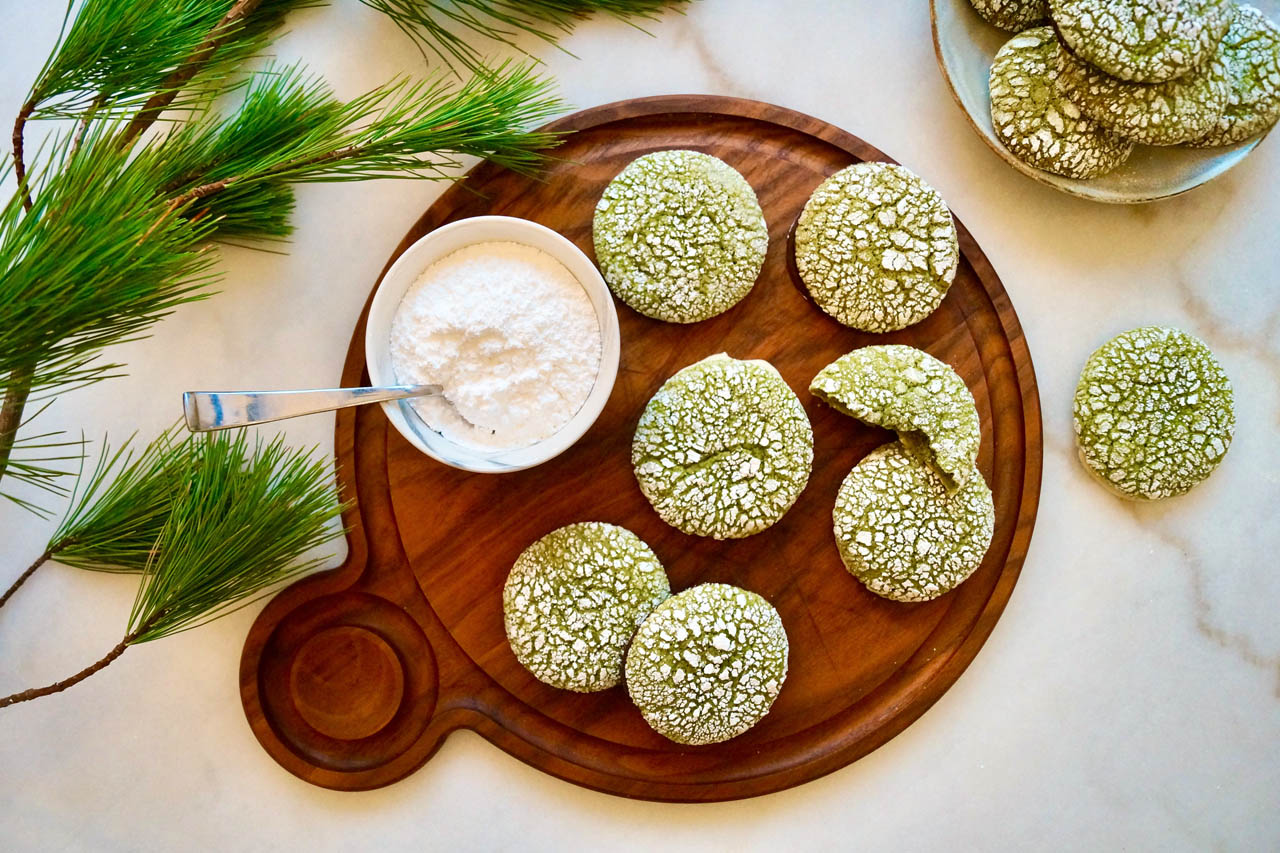 Matcha crinkle cookies on a serving board