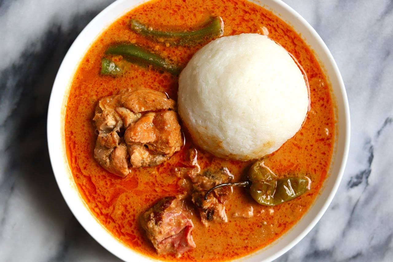 Groundnut soup in a bowl with rice ball