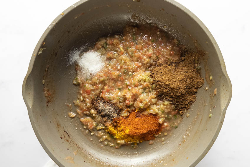Punjabi chole ingredients in a saute pan