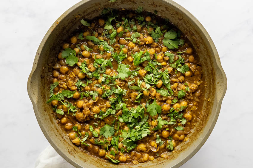 Punjabi chole in a saute pan, ready to serve