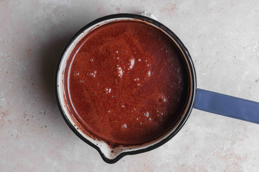 Vegan hot chocolate in a sauce pan