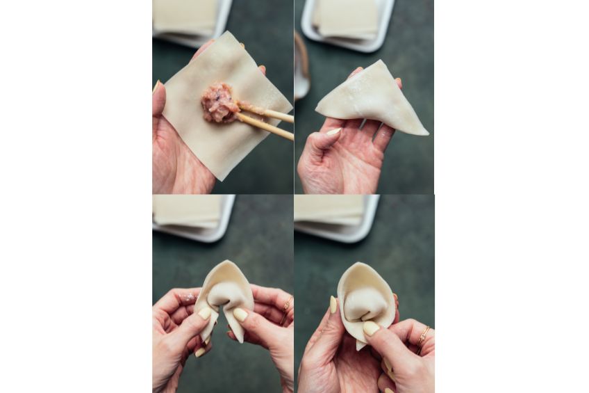A wonton being filled and wrapped