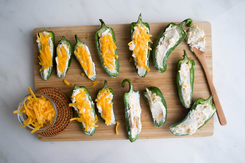 Stuffed jalapenos topped with shredded cheddar