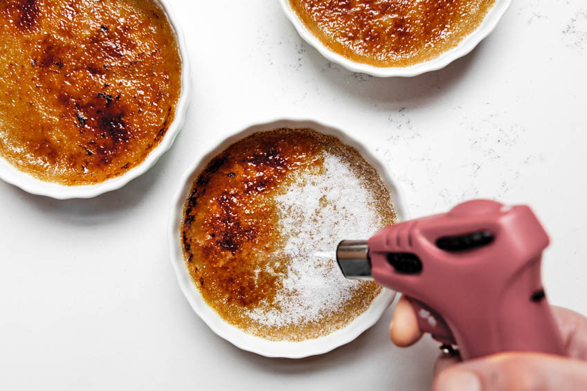 Chai creme brulee being glazed with a blow torch