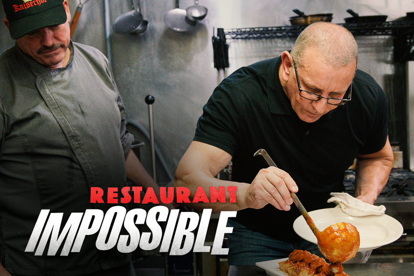 Robert Irvine sauces a dish on an episode of Restaurant Impossible