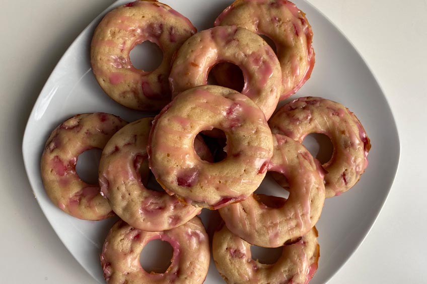 A plate of homemade cherry donuts