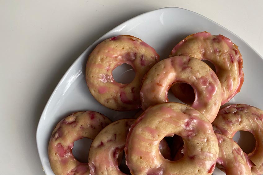 A closeup on homemade cherry donuts