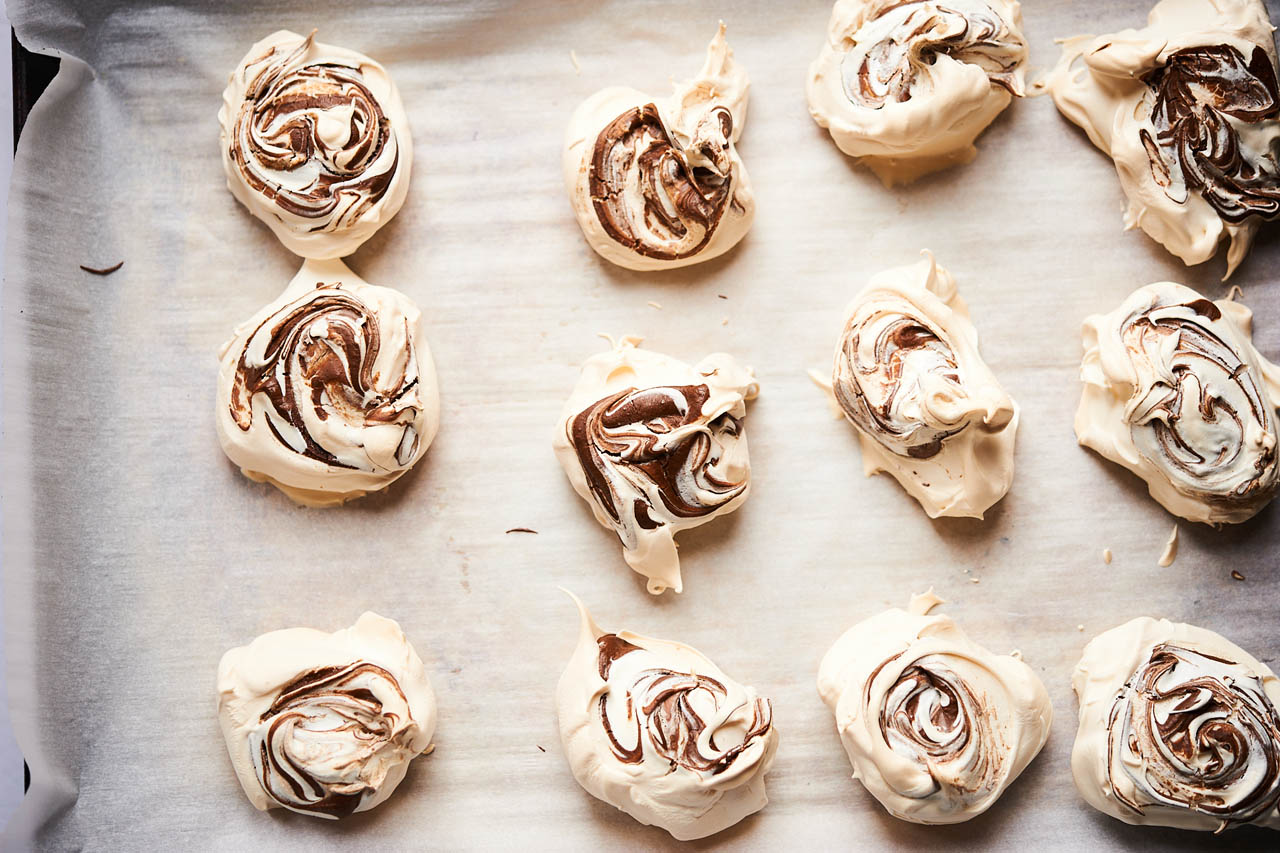 Passover meringues on a sheet of parchment paper