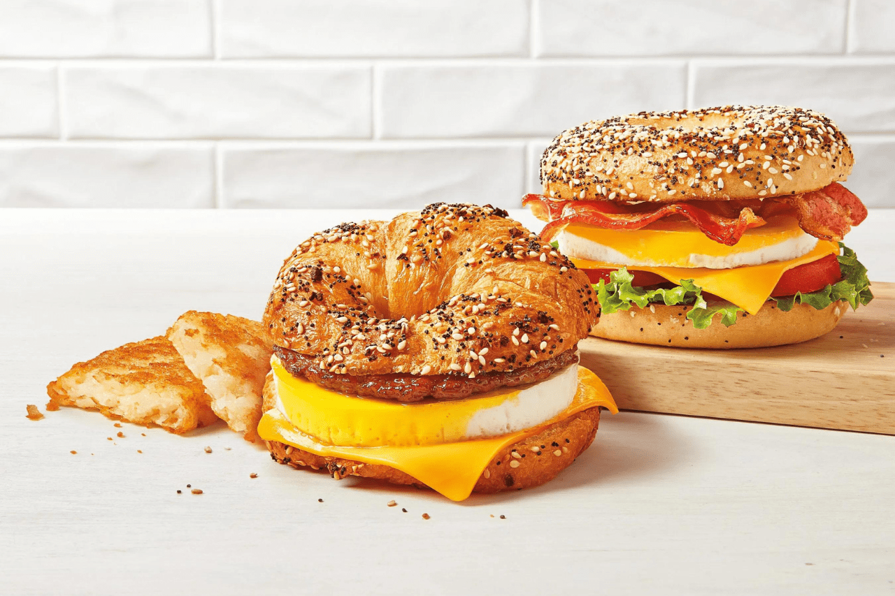 The new Tim Hortons Everything Croissant Breakfast Sandwich, a hashbrown and the BELT on an everything bagel.