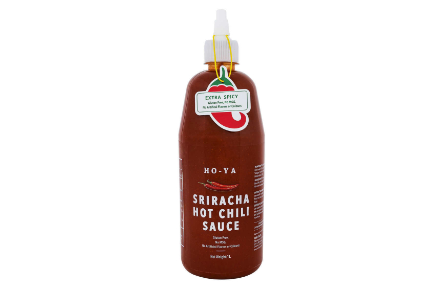 A large 1L bottle of Ho-Ya Sriracha sauce