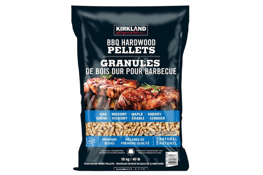 A product shot of a large bag of Kirkland Signature Premium Blend BBQ Hardwood Pellets