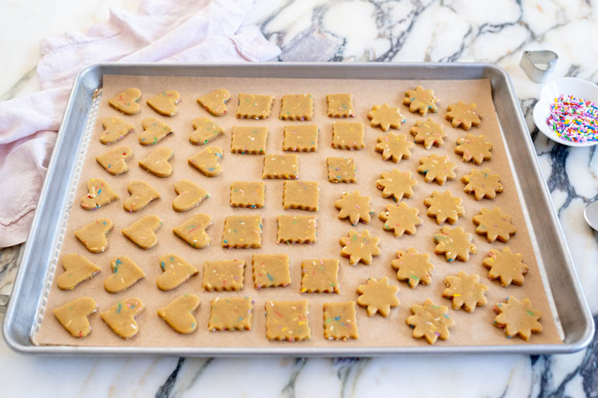 Unbaked funfetti cookies on a baking sheet