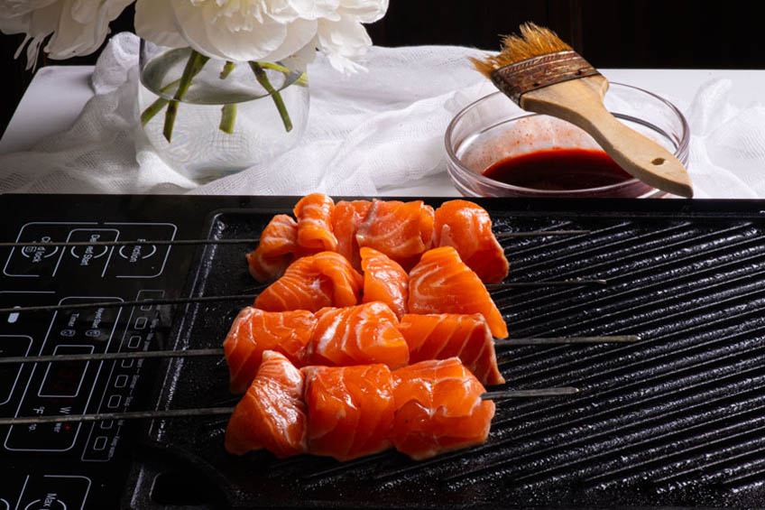 Salmon skewers on a grill