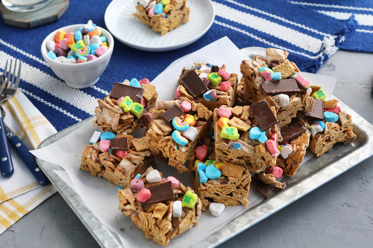 A platter of Kardea Brown's smores cereal bar treats with colourful cereal marshmallows and chocolate topping