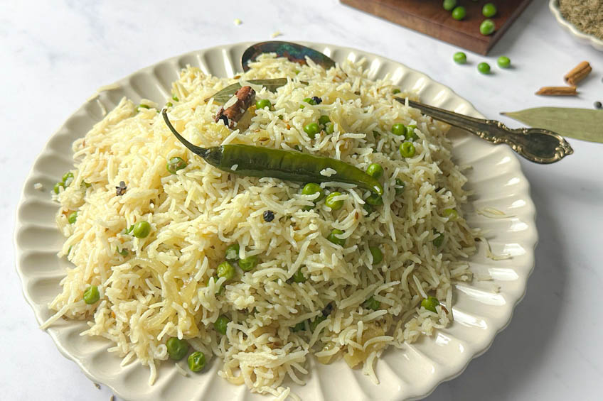 Matar pulao (Green pea rice) on a serving plate