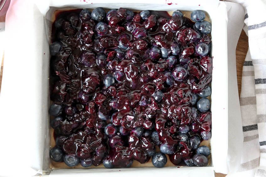 Blueberries over crumb base for Cardamom Sugar Blueberry Bars