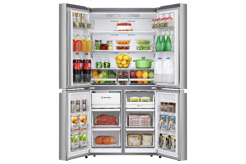 A four-door kitchen refrigerator full of fresh food and produce