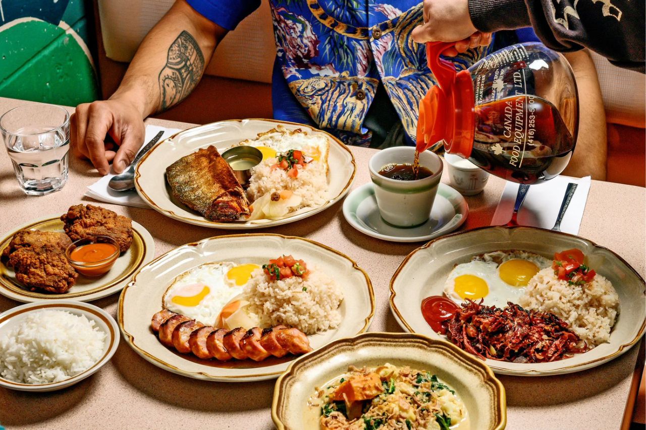 A shot of a restaurant table with various Filipino breakfast dishes