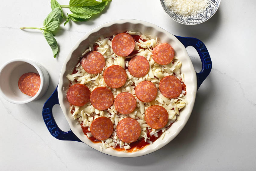 Unbaked pizza dip in a pie dish