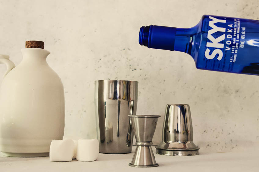 SKYY vodka being added to a cocktail shaker