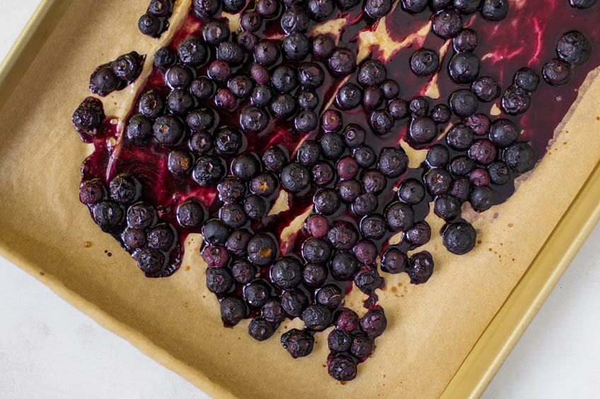Roasted blueberries on a sheet pan