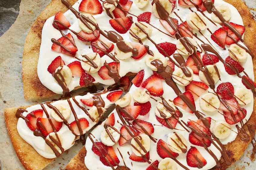 Dessert pizza with bananas and strawberries
