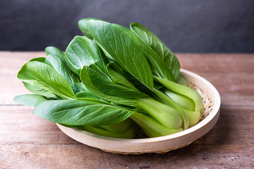 Bok choy in a white plate.