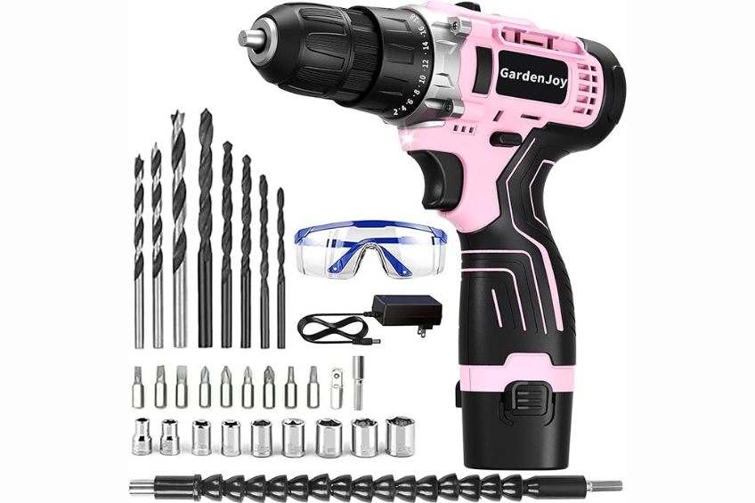 A pink cordless power drill with an assortment of bits and attachments