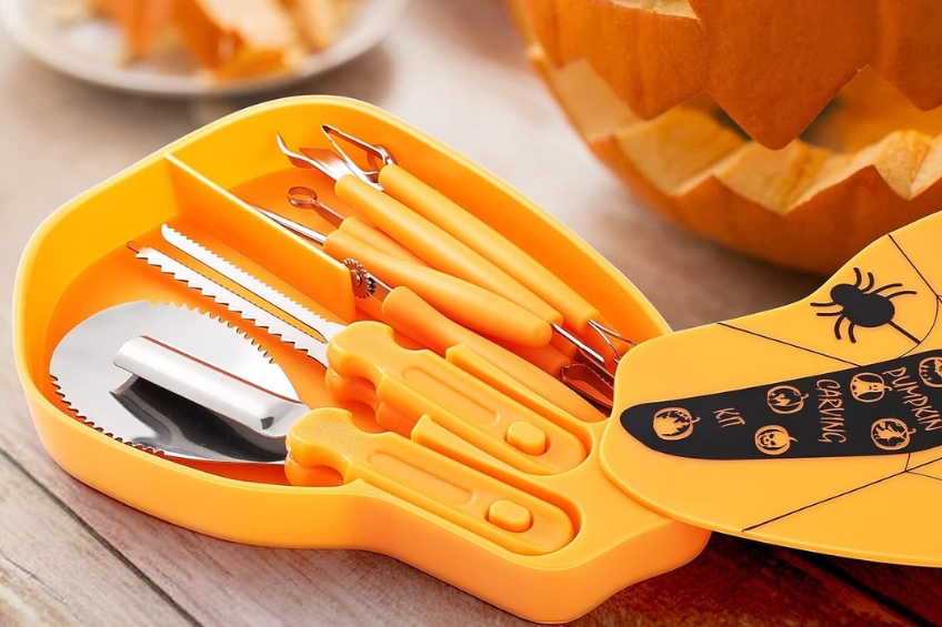 Pumpkin carving tools with orange plastic handles in an orange storage case