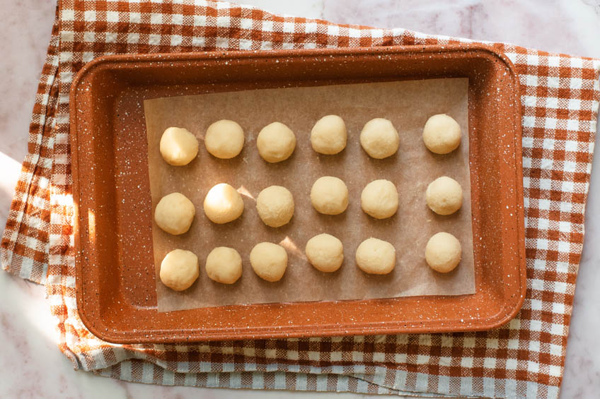 Sesame filling balls on a sheet pan