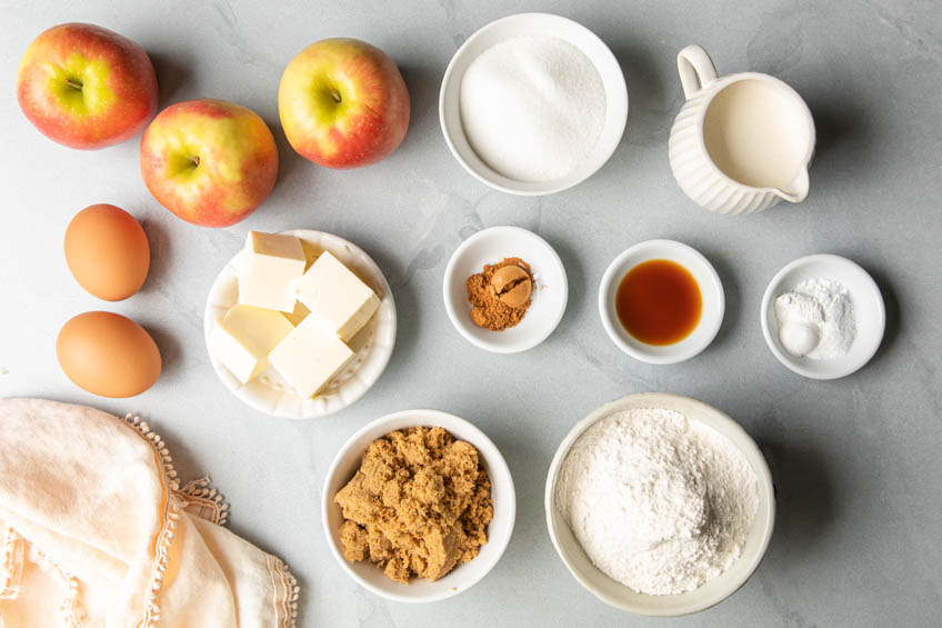 A flat lay of the ingredients for a sticky toffee apple cake