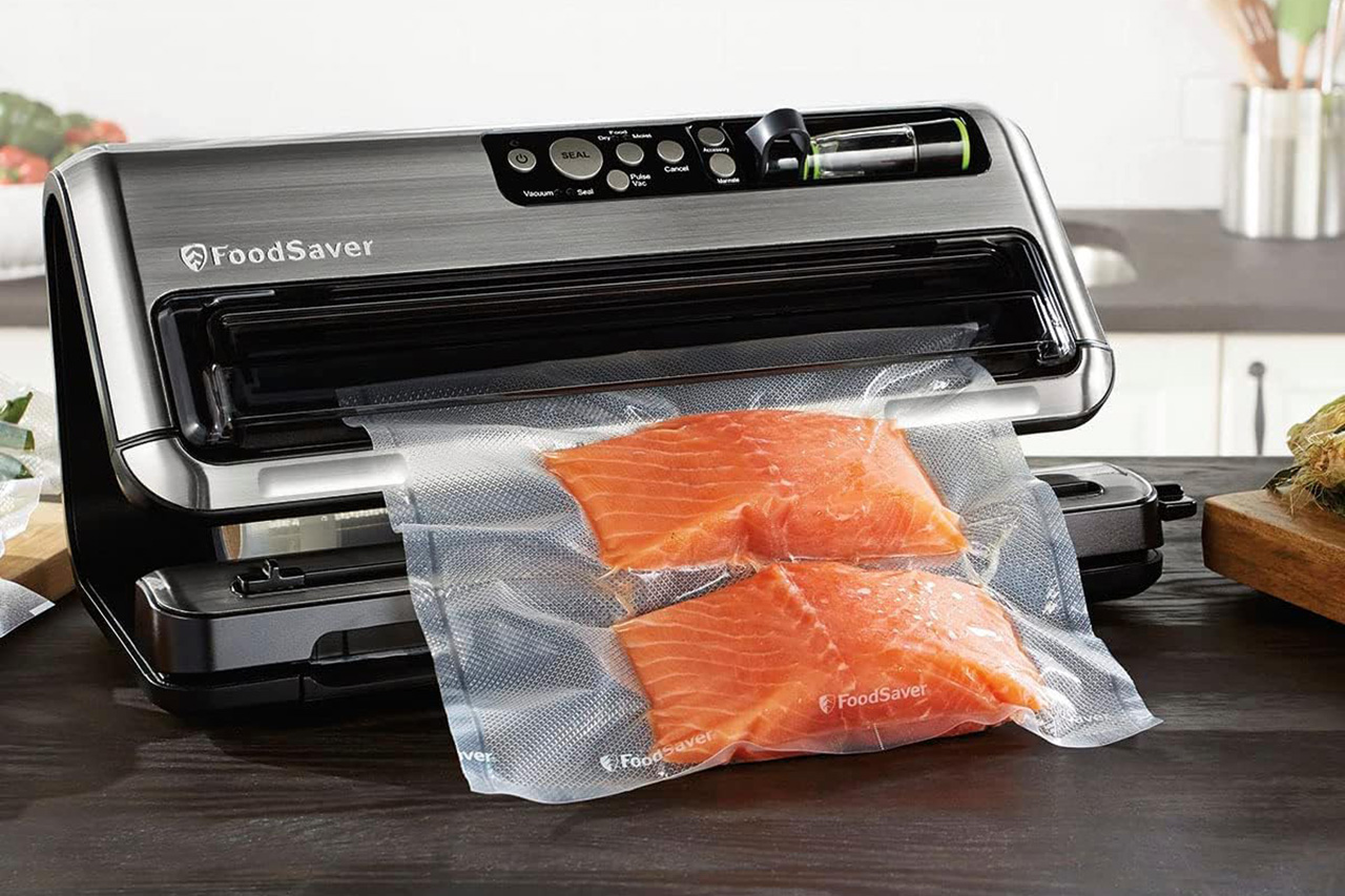 FoodSaver with a two-pack of salmon filets, vacuum sealed.