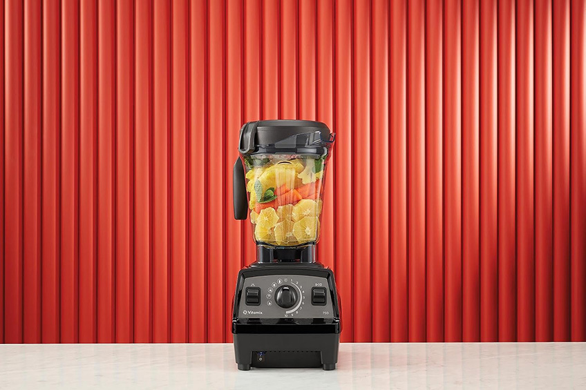 Vitamix propel series 750 blender against a red backdrop