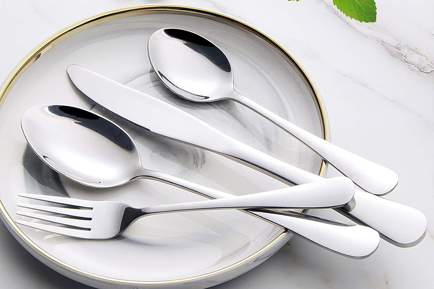 Wildone silverware flatware cutlery set on a plate against a marble countertop