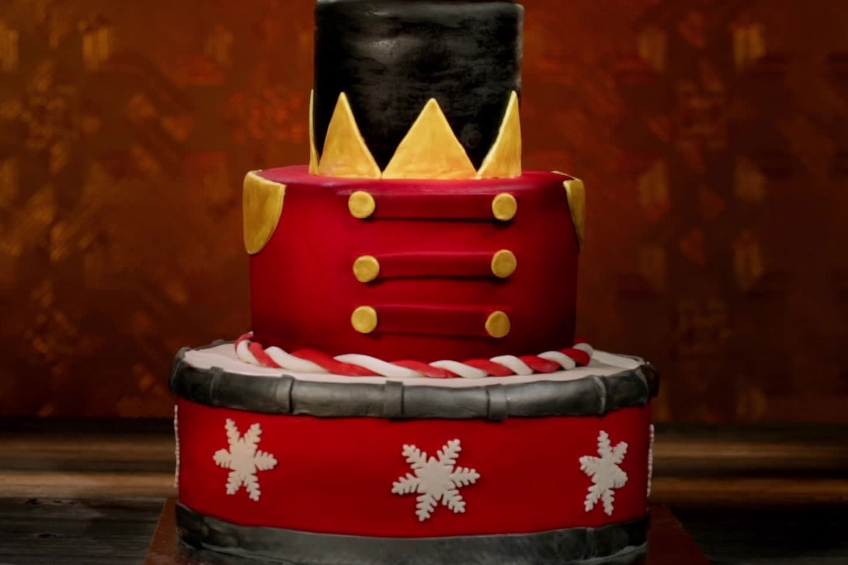 3-tiered Chocolate Hazelnut Cake decorated to look like a toy solder from Holiday Baking Championship Season 4