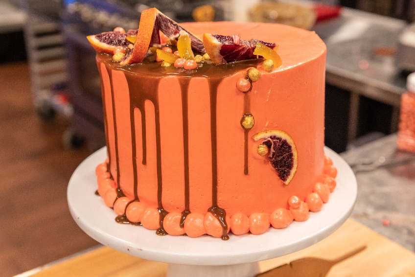 Blood orange cake stuffed with mint infused caramelized blood oranges and mint chocolate with blood orange mousse from Holiday Baking Championship Season 5.