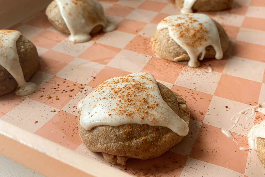A closeup on Taylor Swift chai cookies topped with icing and cinnamon