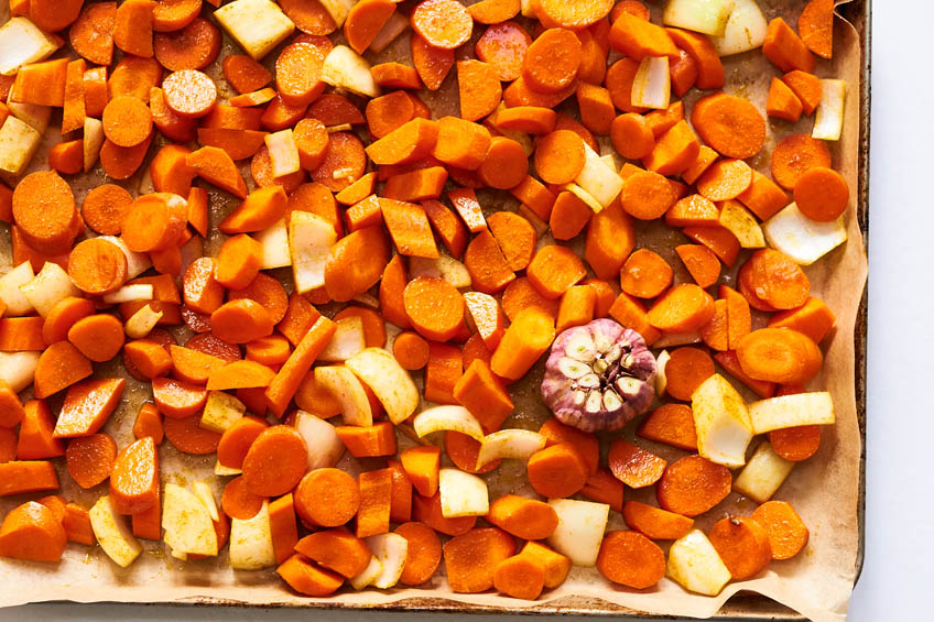 Carrots, onions and garlic on a sheet pan