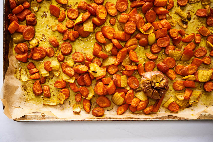 Roasted carrots, onions and garlic on a sheet pan