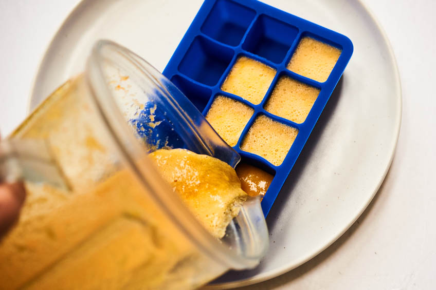 Immunity cube mixture being poured into ice tray