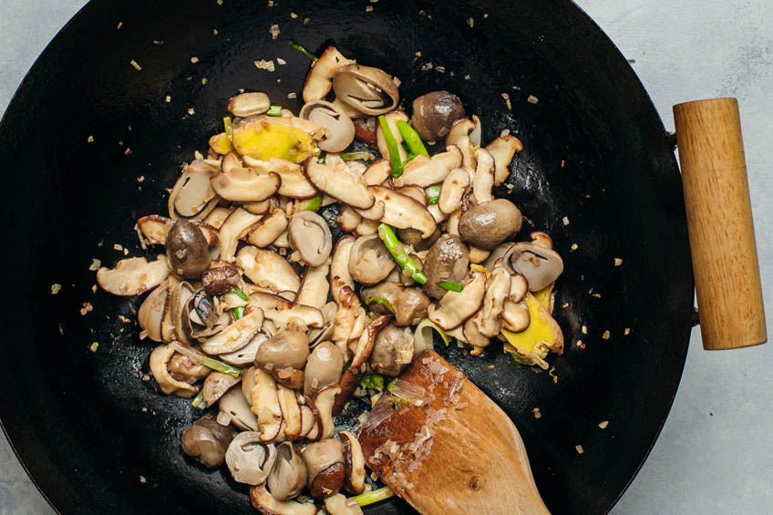 Mushrooms added to wok