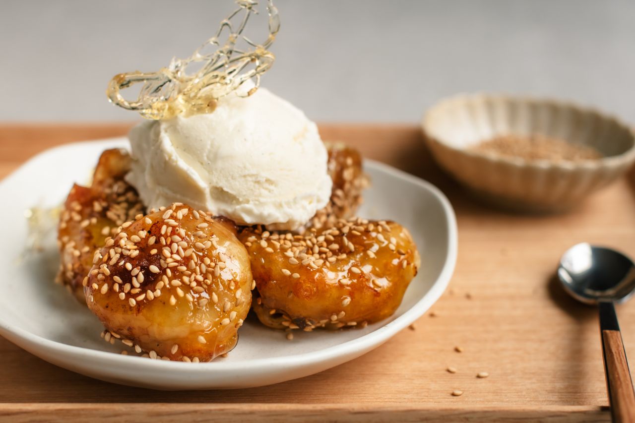 Chinese toffee bananas topped with vanilla ice cream