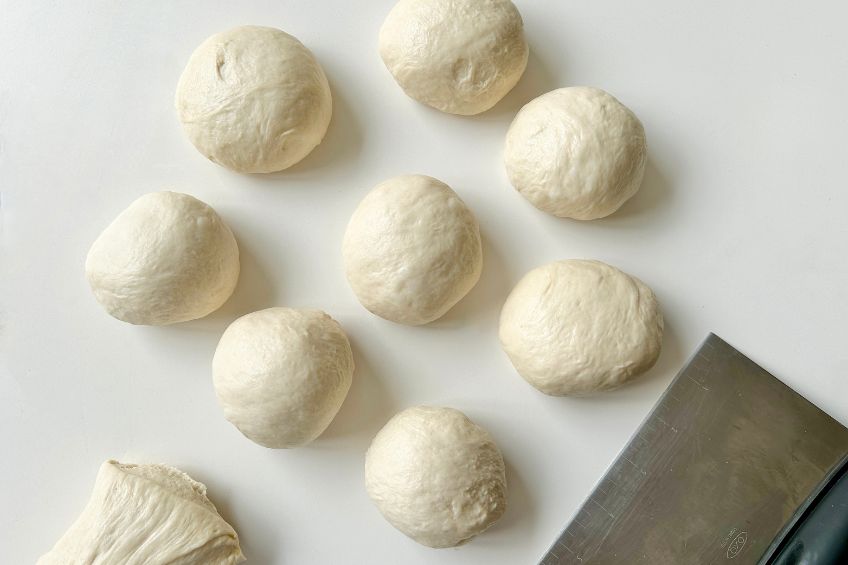 Pretzel dough balls on a countertop