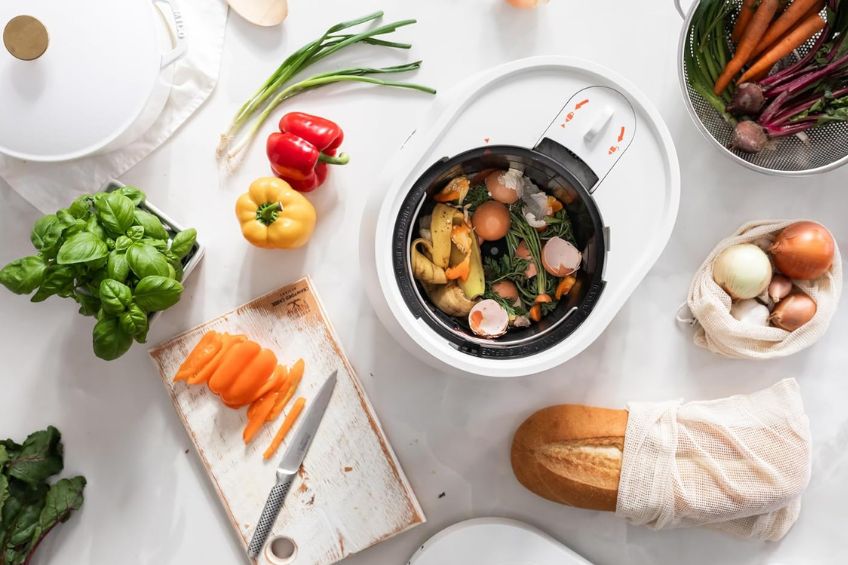 Flat lay POV of Lomi Smart Waste Electric Kitchen Composter