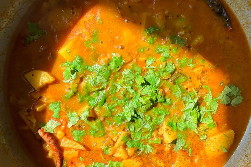 Potato curry topped with cilantro