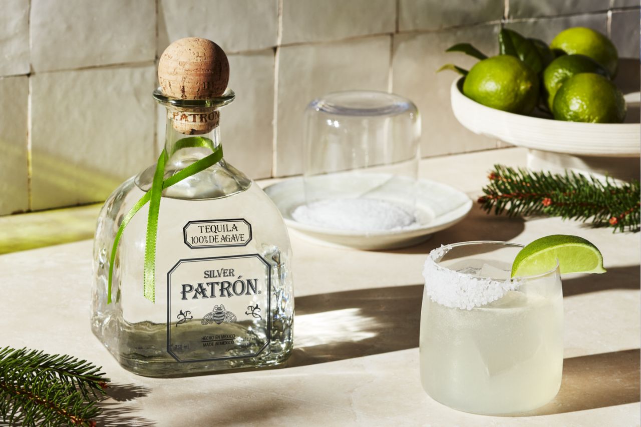 A bottle of Patron Silver beside a margarita