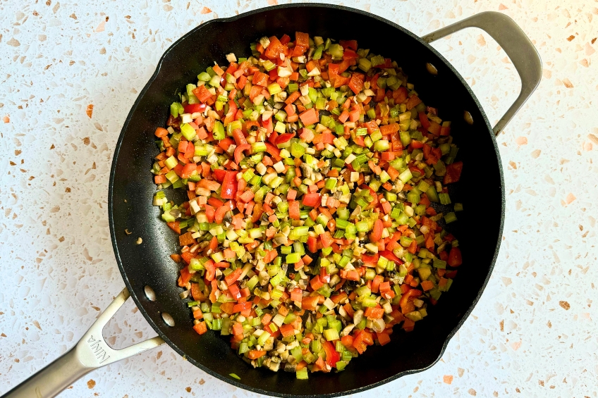 Mushrooms and peppers added to pan