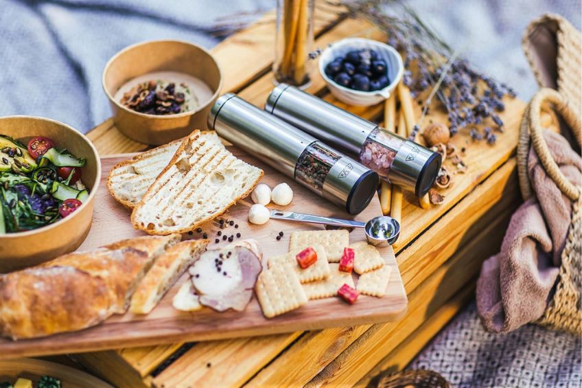 Salt and pepper grinder on a charcuturie board picnic