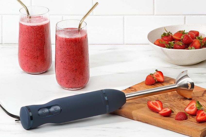 Chefman Immersion Hand Blender on kitchen counter with strawberries and strawberry smoothies