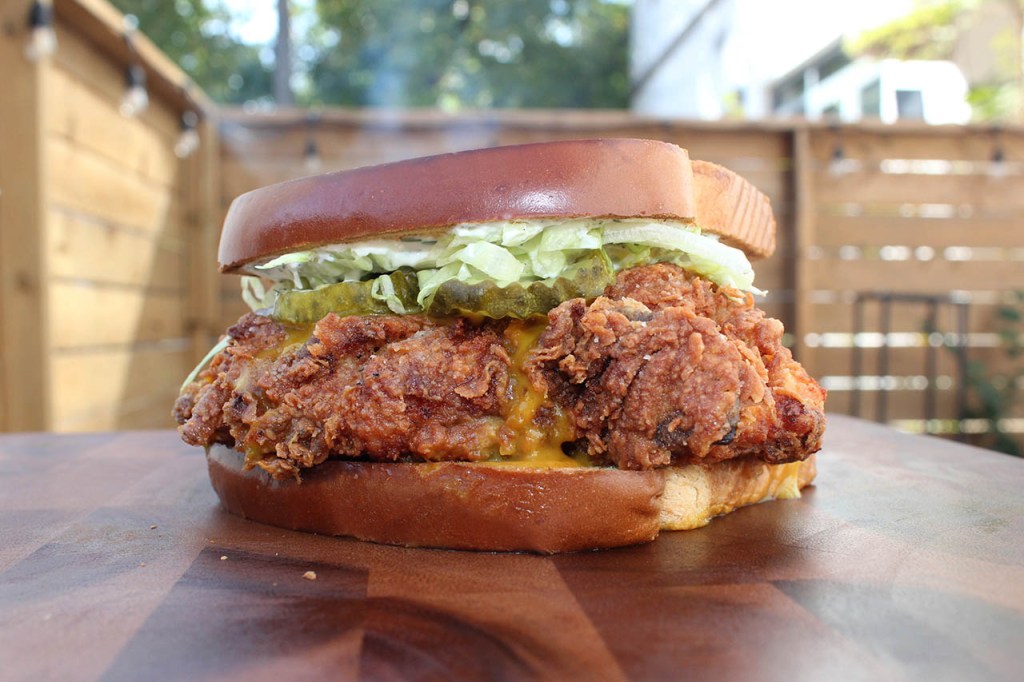 fried chicken sandwich on toasted bread with honey mustard